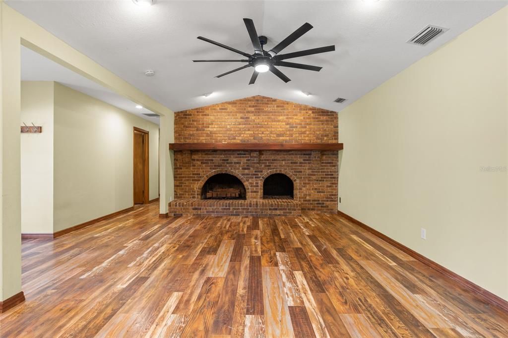 Empty room, Fireplace, Interior, Recessed Lighting, Stone Walls, Wood Texture Flooring