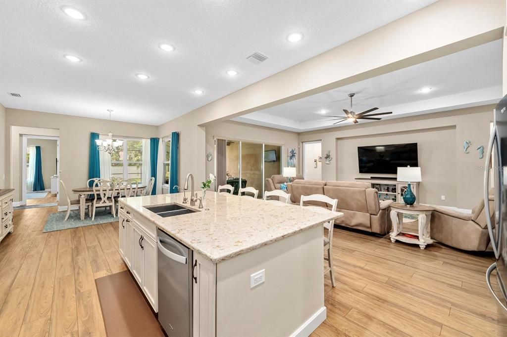 Chandelier, Dining room, Interior, Kitchen, Living room, Recessed Lighting, Wood Texture Flooring