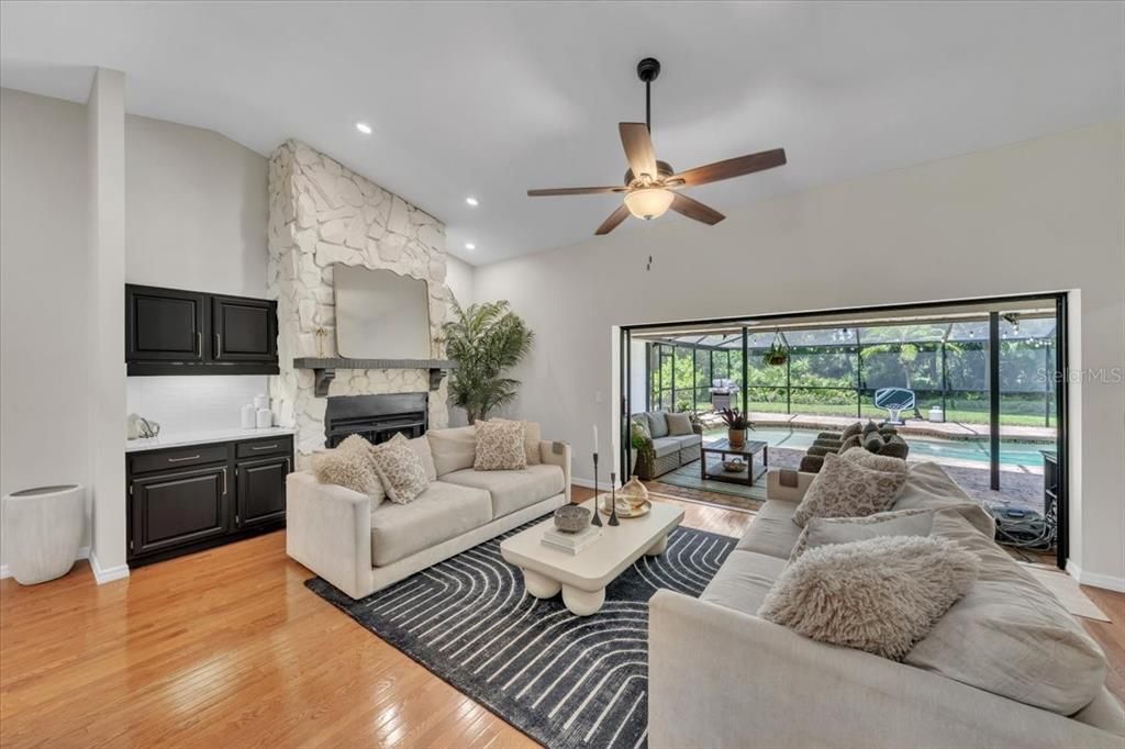 Fireplace, Interior, Living room, Recessed Lighting, Stone Walls, Wood Texture Flooring