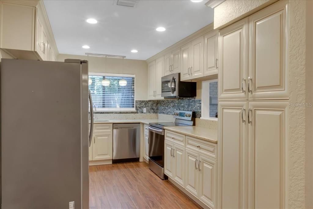 Interior, Kitchen, Pendant Lights, Recessed Lighting, Stainless Steel Appliances, Wood Texture Flooring