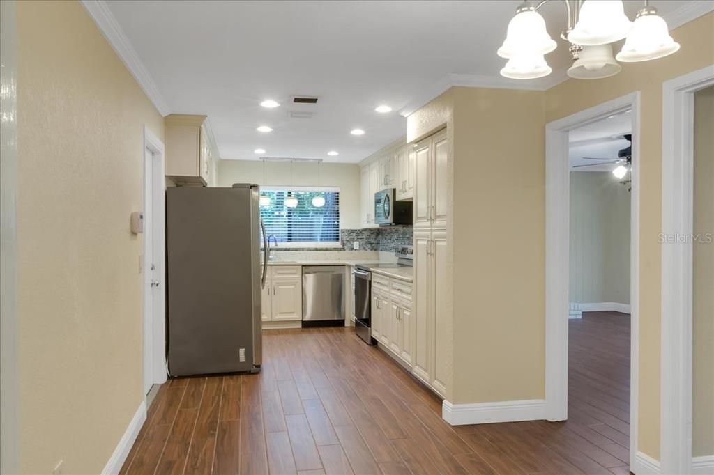 Interior, Kitchen, Pendant Lights, Recessed Lighting, Stainless Steel Appliances, Wood Texture Flooring