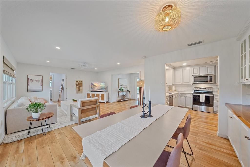 Dining room, Interior, Kitchen, Living room, Recessed Lighting, Stainless Steel Appliances, Wood Texture Flooring