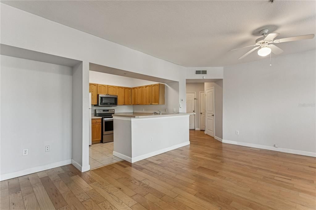 Empty room, Interior, Kitchen, Stainless Steel Appliances, Wood Texture Flooring