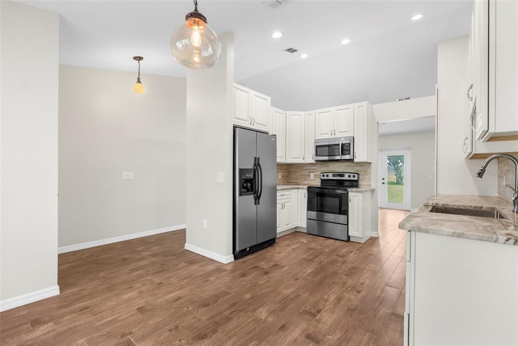 Interior, Kitchen, Pendant Lights, Recessed Lighting, Stainless Steel Appliances, Wood Texture Flooring