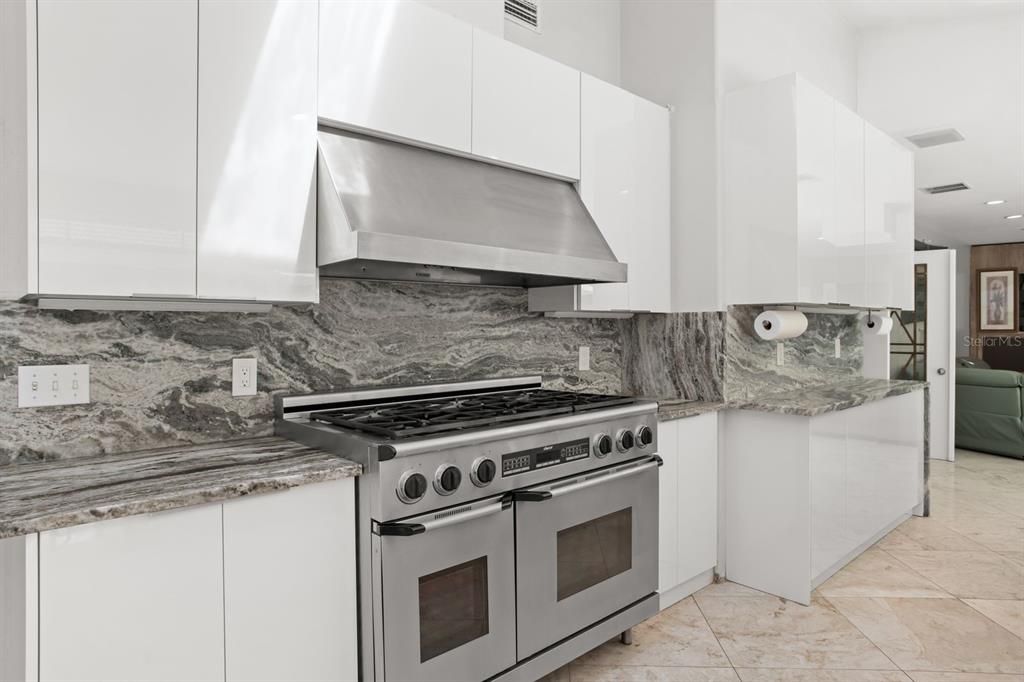 Interior, Kitchen, Marble Walls, Recessed Lighting, Stainless Steel Appliances