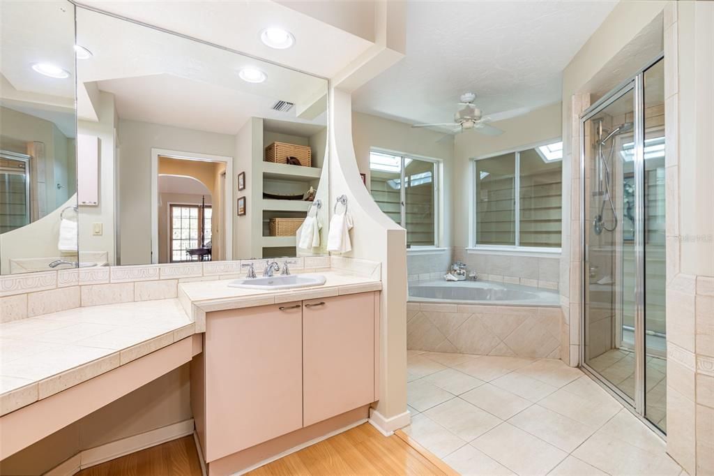Bathroom, Dual Sink Vanities, Glass Shower, Interior, Recessed Lighting, Tile Countertops, Wood Texture Flooring