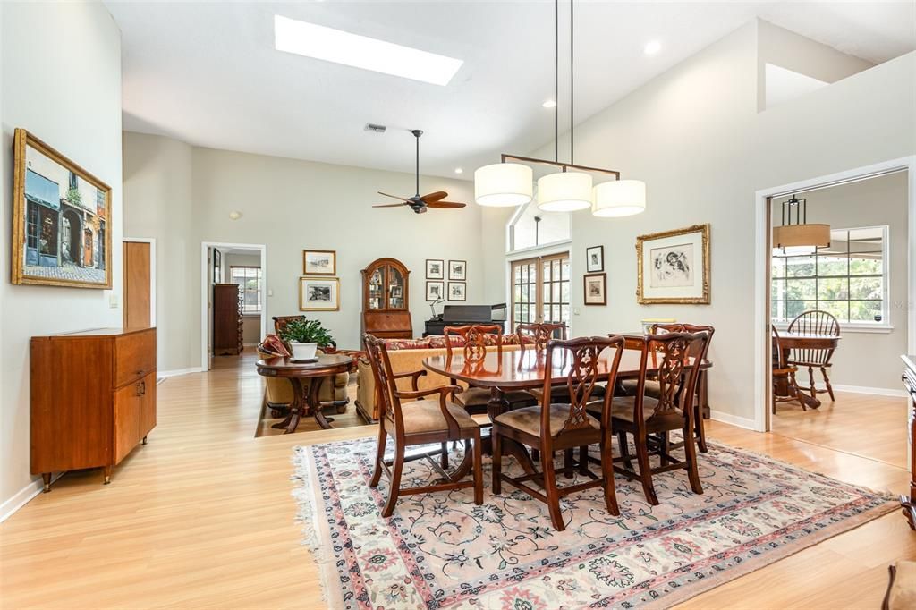 Chandelier, Dining room, Interior, Pendant Lights, Piano, Recessed Lighting, Wood Texture Flooring