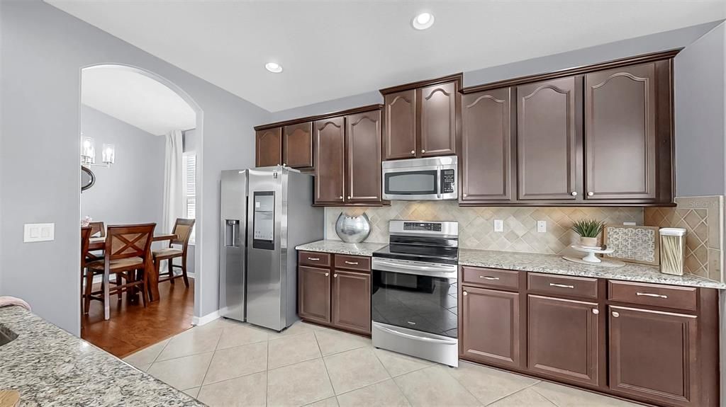 Dining room, Interior, Kitchen, Recessed Lighting, Stainless Steel Appliances, Wood Texture Flooring