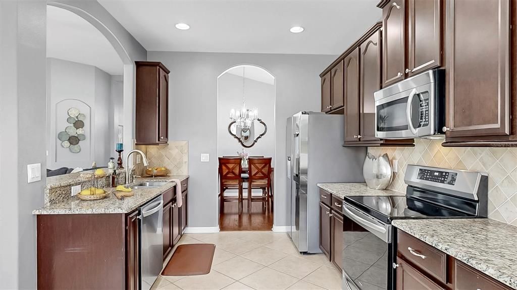 Chandelier, Dining room, Interior, Kitchen, Recessed Lighting, Stainless Steel Appliances