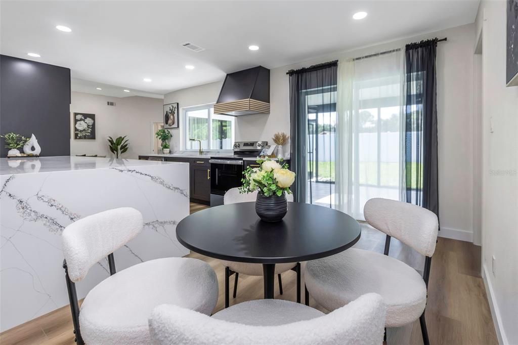 Dining room, Interior, Kitchen, Recessed Lighting, Stainless Steel Appliances, Wood Texture Flooring