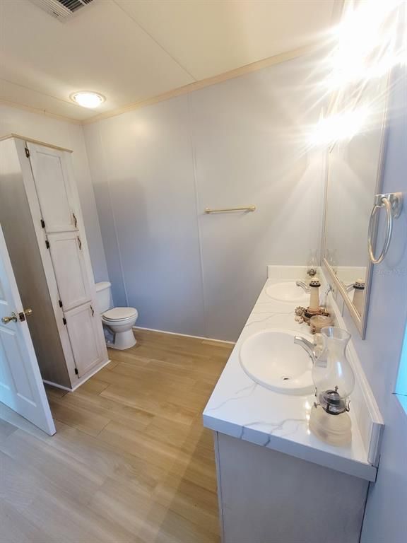 Bathroom, Dual Sink Vanities, Interior, Recessed Lighting, Wood Texture Flooring