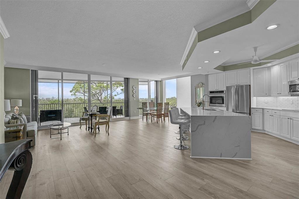 Dining room, Interior, Kitchen, Recessed Lighting, Stainless Steel Appliances, Wood Texture Flooring