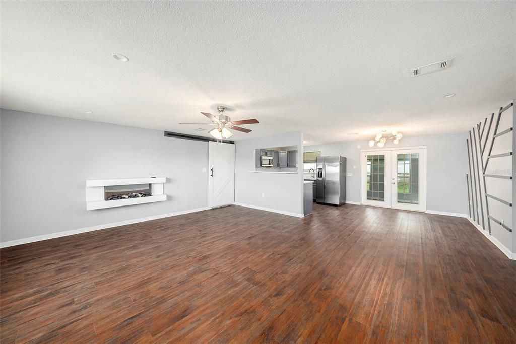 Empty room, Fireplace, Interior, Recessed Lighting, Wood Texture Flooring