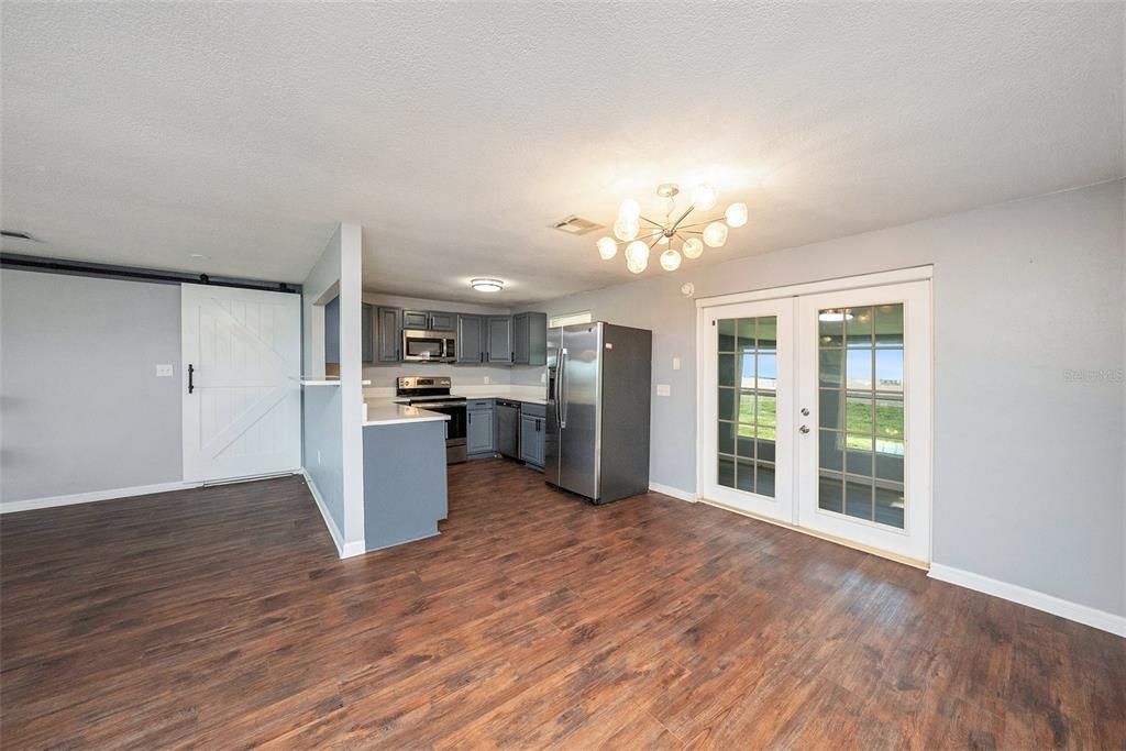 Empty room, Interior, Kitchen, Stainless Steel Appliances, Wood Texture Flooring