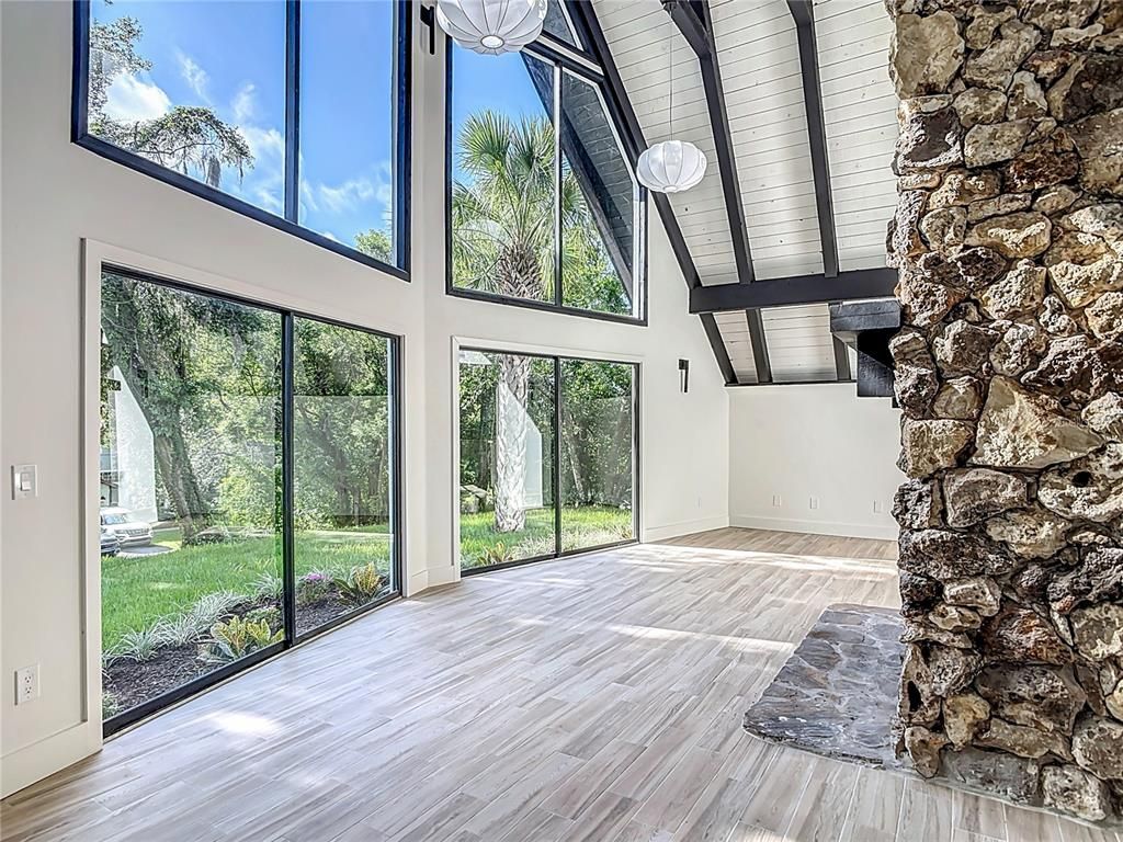 Empty room, Fireplace, Interior, Stone Walls, Sun Room, Wood Texture Flooring