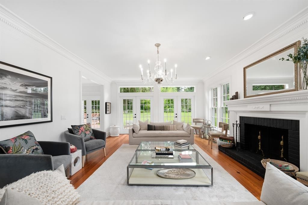 Chandelier, Fireplace, Interior, Living room, Recessed Lighting, Wood Texture Flooring