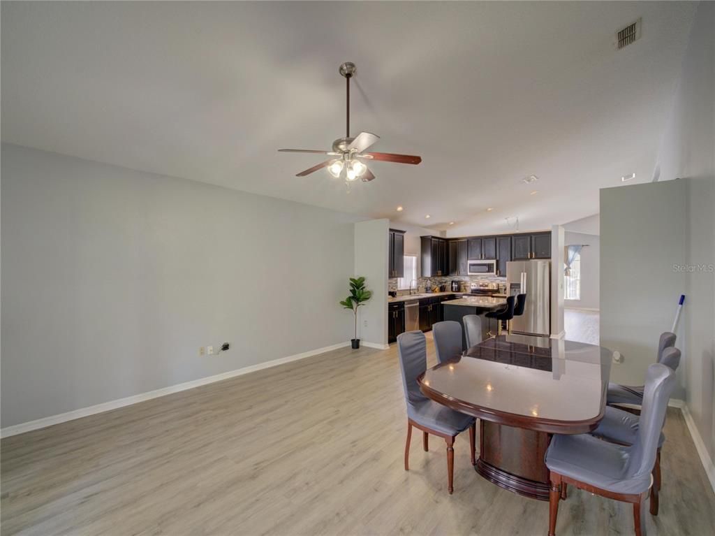 Dining room, Interior, Kitchen, Recessed Lighting, Stainless Steel Appliances, Wood Texture Flooring