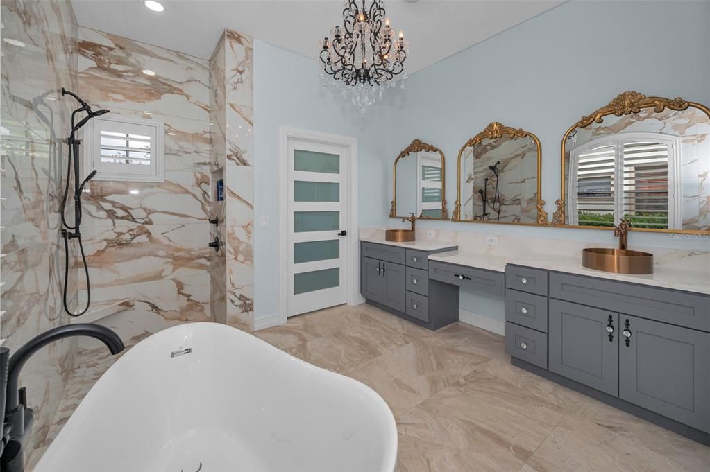 Bathroom, Chandelier, Dual Sink Vanities, Free Standing Baths, Interior, Marble, Marble Walls, Recessed Lighting
