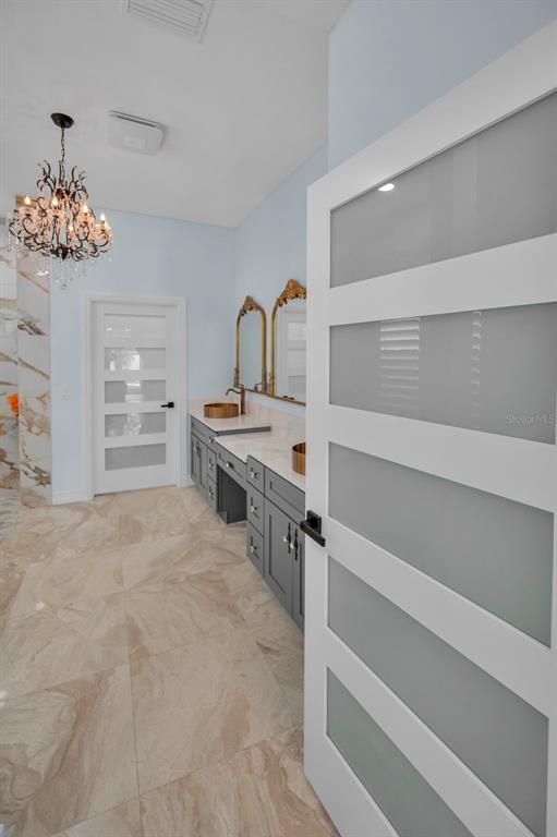 Bathroom, Chandelier, Dual Sink Vanities, Interior, Marble, Recessed Lighting, Walk-in Closets