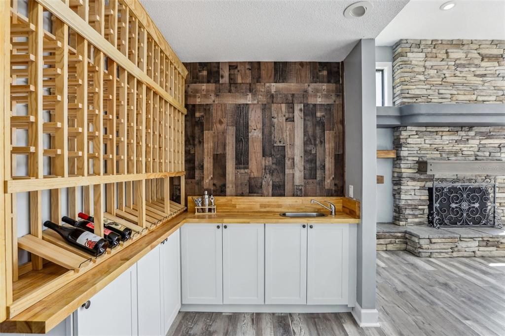 Fireplace, Interior, Stone Walls, Wine Storage, Wood Texture Flooring, Wooden Walls