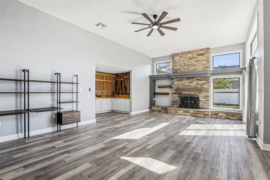 Empty room, Fireplace, Interior, Recessed Lighting, Stone Walls, Wood Texture Flooring