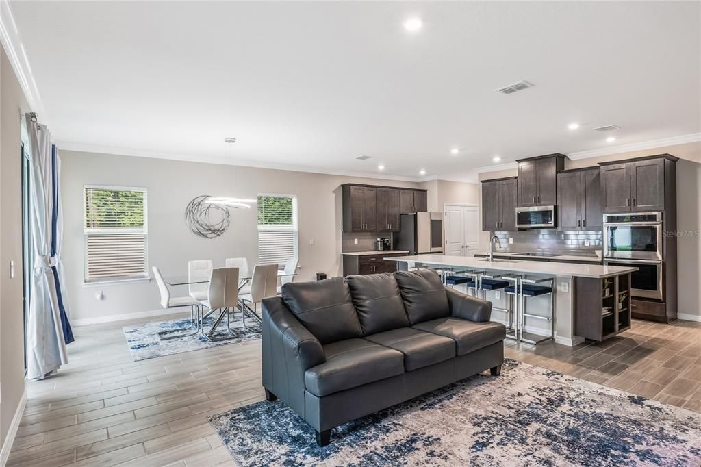 Dining room, Interior, Kitchen, Living room, Pendant Lights, Recessed Lighting, Stainless Steel Appliances, Wood Texture Flooring