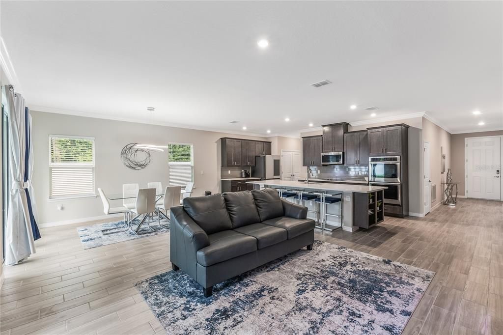 Dining room, Interior, Kitchen, Living room, Recessed Lighting, Stainless Steel Appliances, Wood Texture Flooring