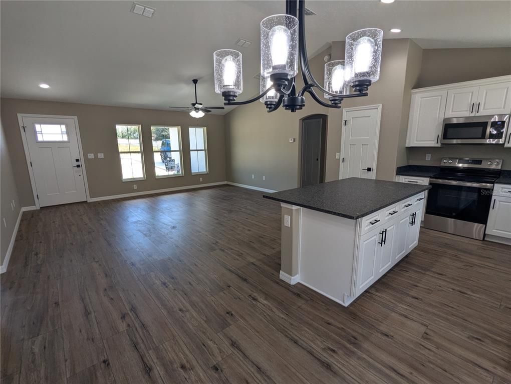 Chandelier, Interior, Kitchen, Recessed Lighting, Stainless Steel Appliances, Wood Texture Flooring