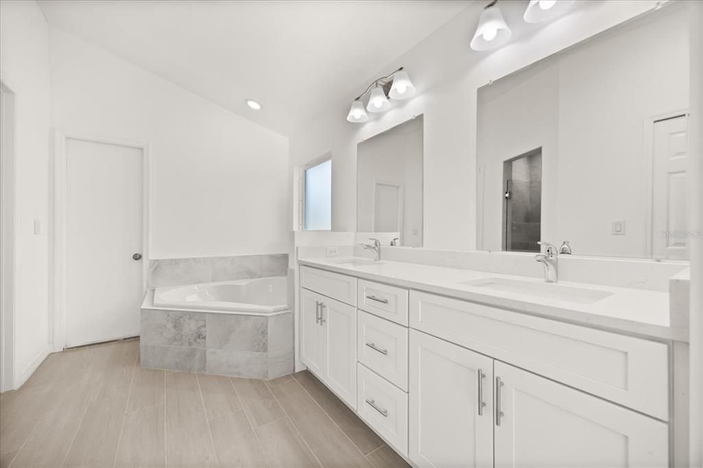 Bathroom, Dual Sink Vanities, Interior, Recessed Lighting, Wood Texture Flooring