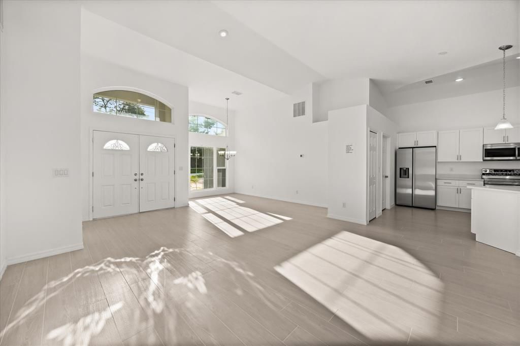 Empty room, Interior, Kitchen, Pendant Lights, Recessed Lighting, Stainless Steel Appliances, Wood Texture Flooring