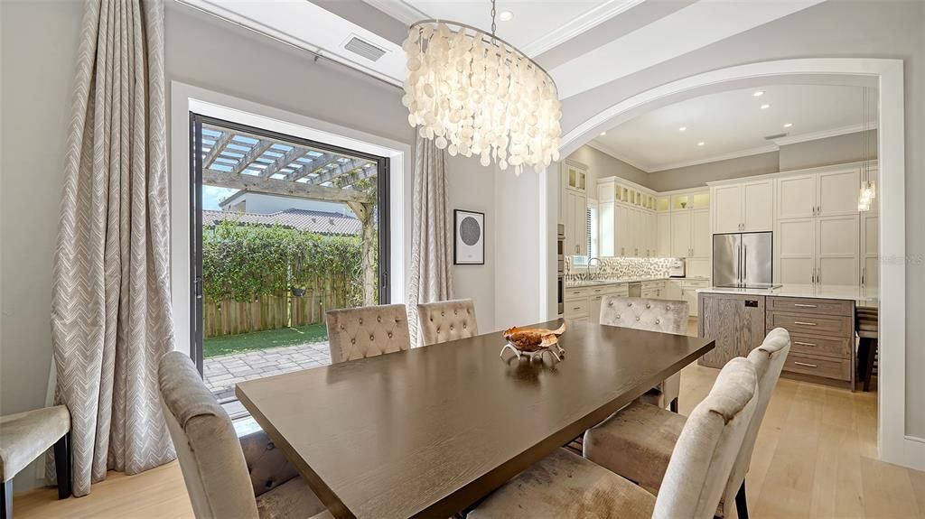 Chandelier, Dining room, Interior, Kitchen, Recessed Lighting, Stainless Steel Appliances, Wood Texture Flooring