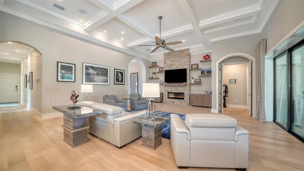 Fireplace, Interior, Living room, Recessed Lighting, Stone Walls, Wood Texture Flooring