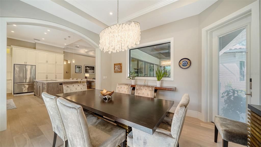 Chandelier, Dining room, Interior, Kitchen, Pendant Lights, Recessed Lighting, Stainless Steel Appliances, Wood Texture Flooring