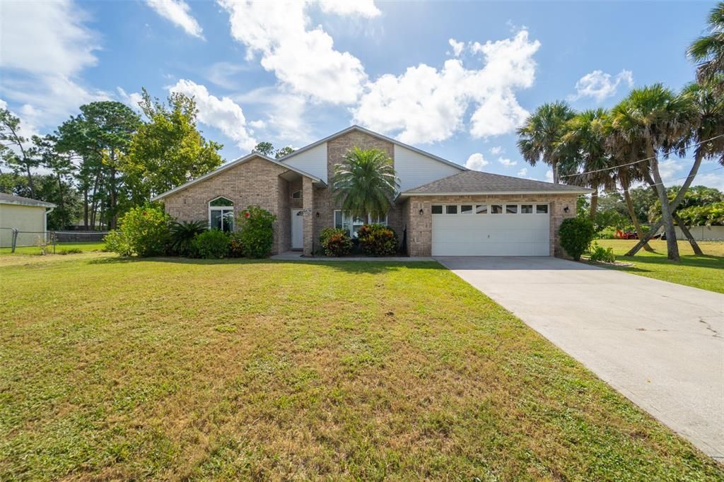 Attached, Backyard, Exterior, Facade, Brick Facade, Ranch