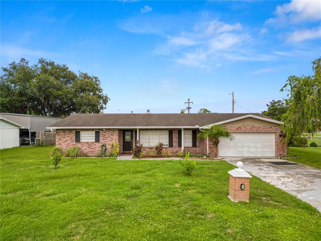 Attached, Backyard, Exterior, Facade, Brick Facade, Ranch