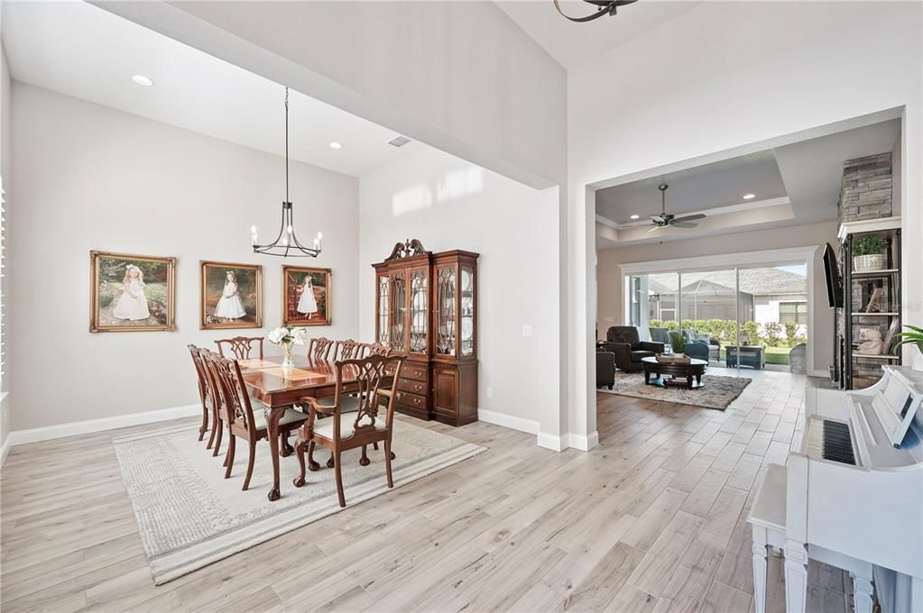 Chandelier, Dining room, Interior, Pendant Lights, Piano, Recessed Lighting, Wood Texture Flooring