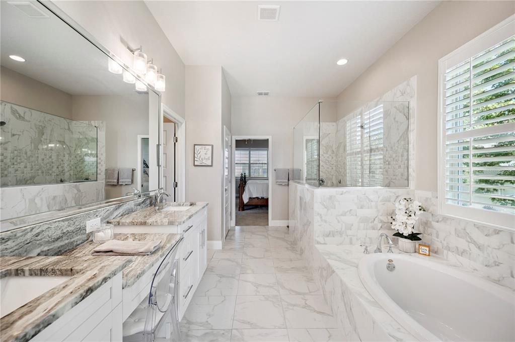 Bathroom, Dual Sink Vanities, Glass Shower, Interior, Marble, Marble Walls, Recessed Lighting