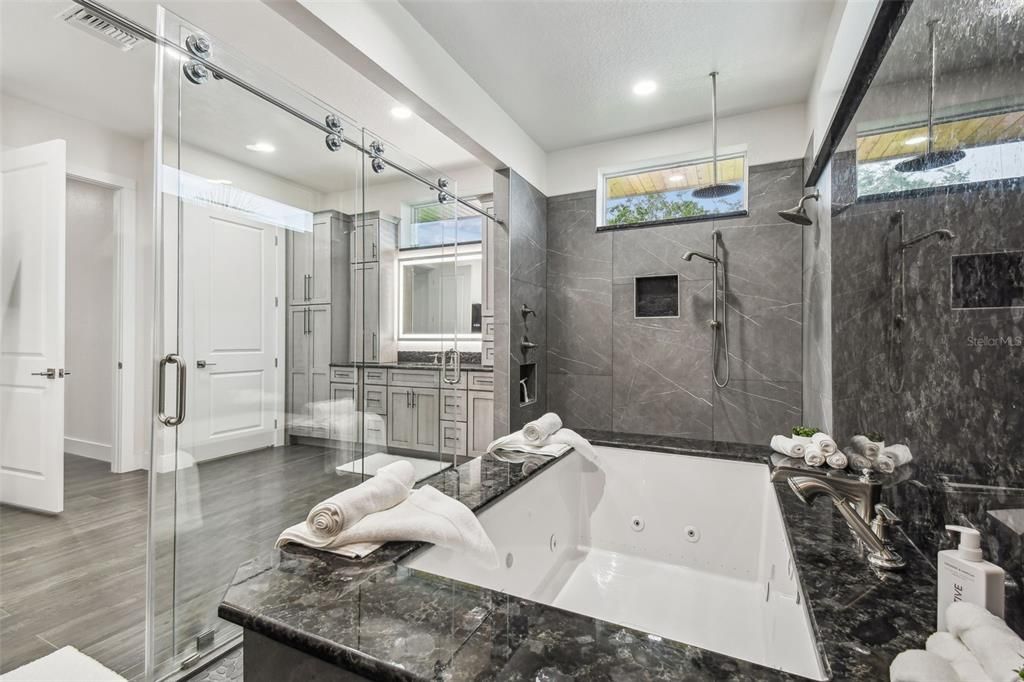 Bathroom, Dual Sink Vanities, Glass Shower, Interior, Recessed Lighting, Wood Texture Flooring