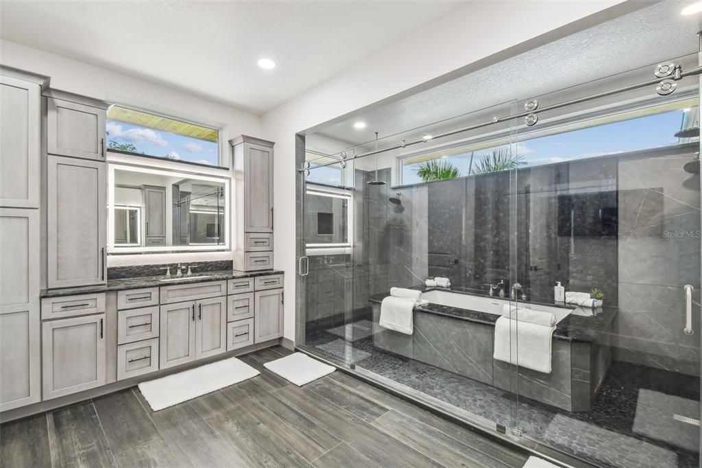 Bathroom, Dual Sink Vanities, Glass Shower, Interior, Recessed Lighting, Wood Texture Flooring