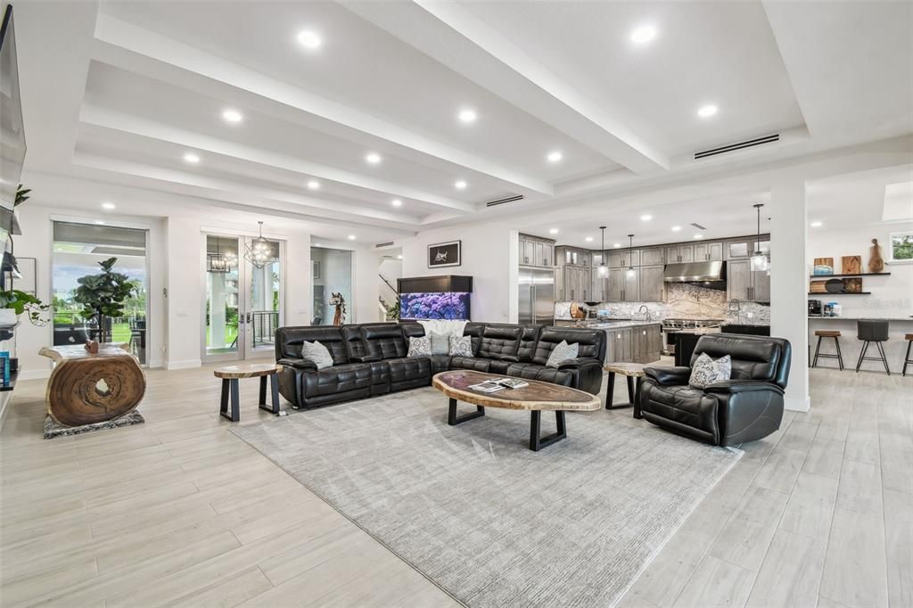 Interior, Kitchen, Living room, Marble Walls, Pendant Lights, Recessed Lighting, Stainless Steel Appliances, Wood Texture Flooring