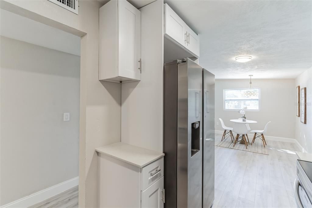 Chandelier, Dining room, Interior, Kitchen, Stainless Steel Appliances, Wood Texture Flooring