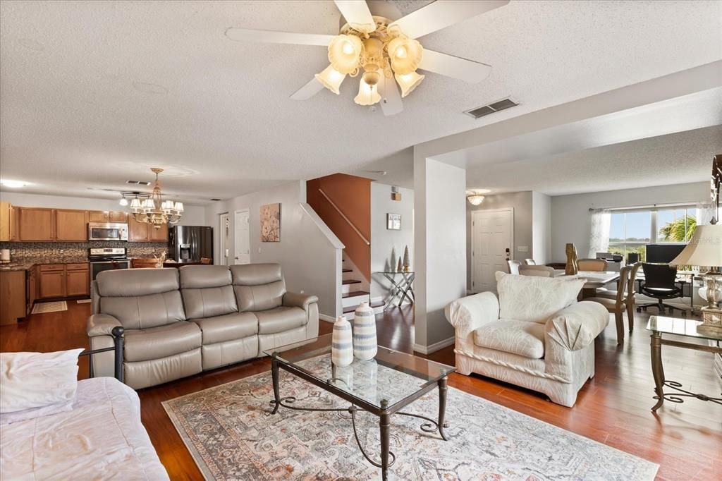Chandelier, Dining room, Interior, Kitchen, Living room, Recessed Lighting, Stainless Steel Appliances, Wood Texture Flooring