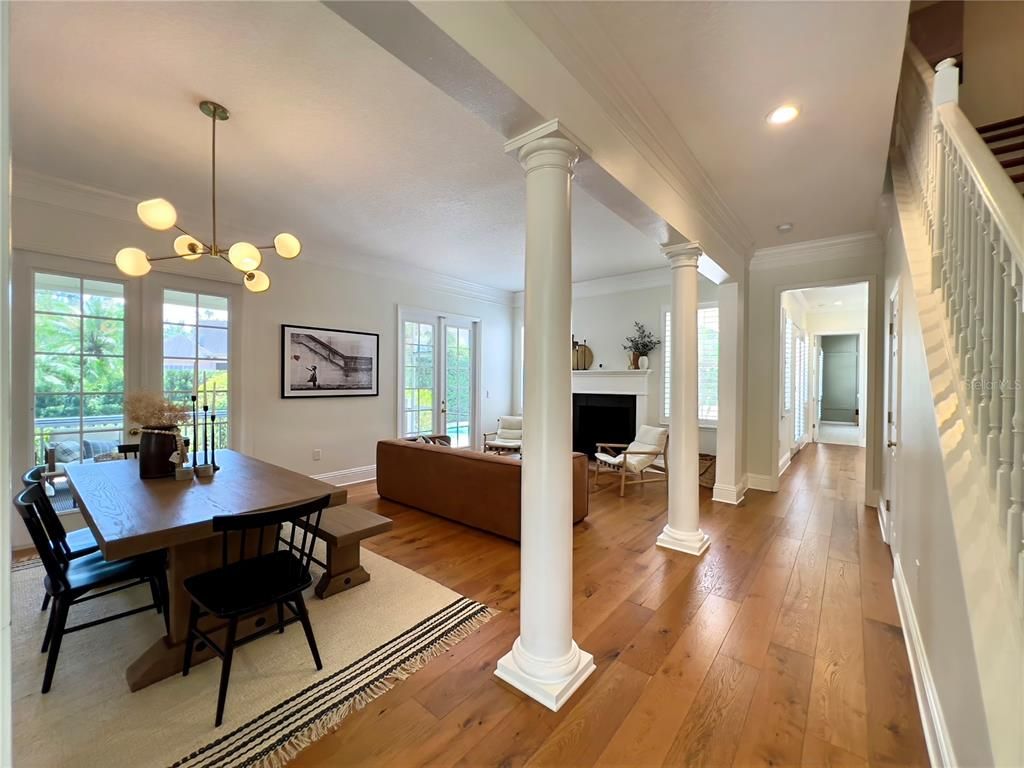 Dining room, Fireplace, Interior, Living room, Pendant Lights, Recessed Lighting, Wood Texture Flooring
