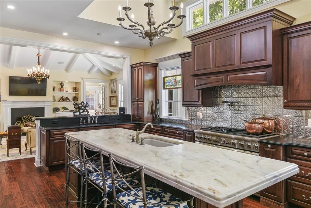 Chandelier, Fireplace, Interior, Kitchen, Recessed Lighting, Wood Texture Flooring