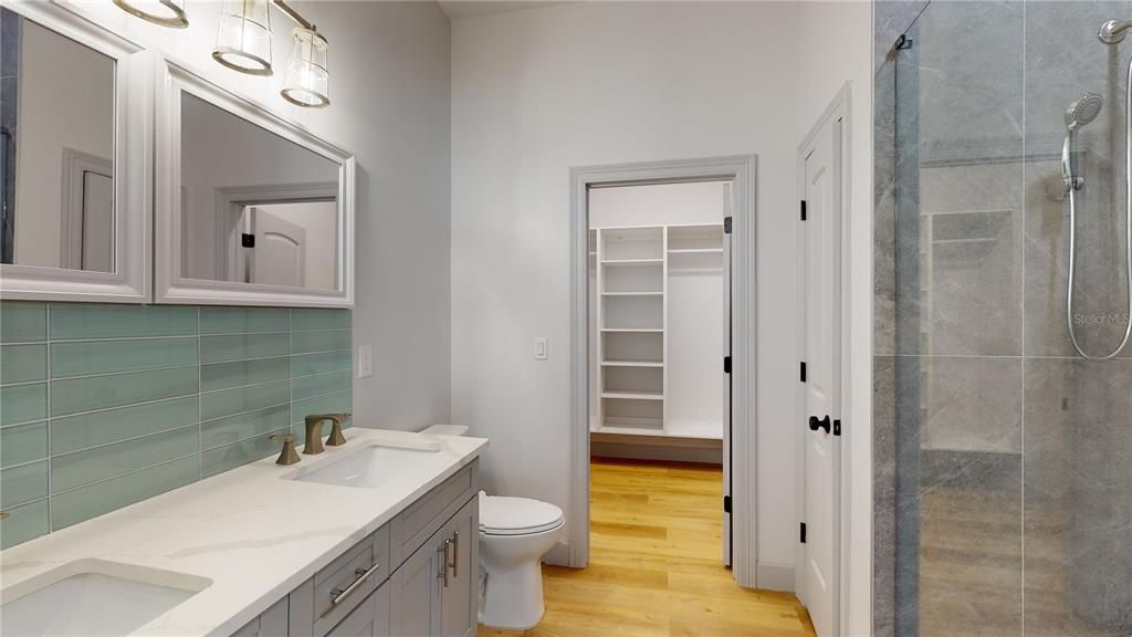 Bathroom, Dual Sink Vanities, Glass Shower, Interior, Walk-in Closets, Wood Texture Flooring