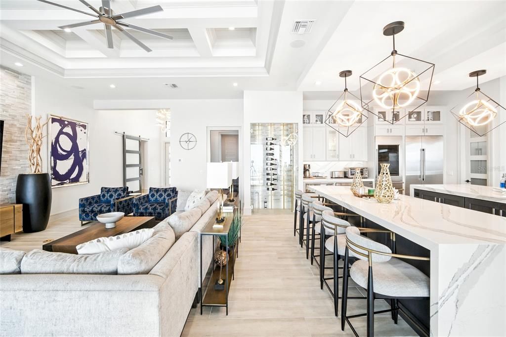 Chandelier, Interior, Kitchen, Living room, Pendant Lights, Recessed Lighting, Stainless Steel Appliances, Wood Texture Flooring