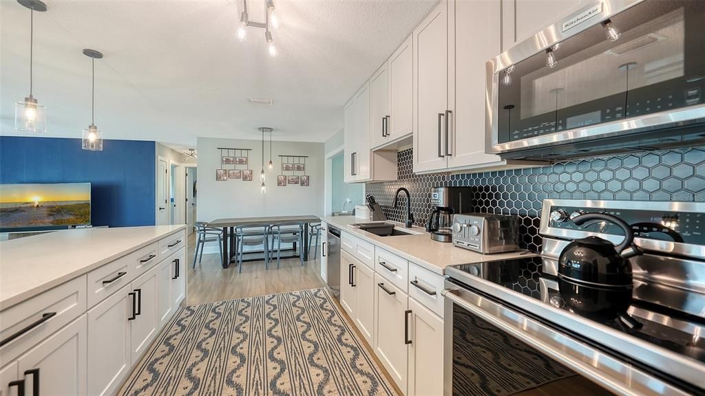 Dining room, Interior, Kitchen, Pendant Lights, Stainless Steel Appliances, Wood Texture Flooring