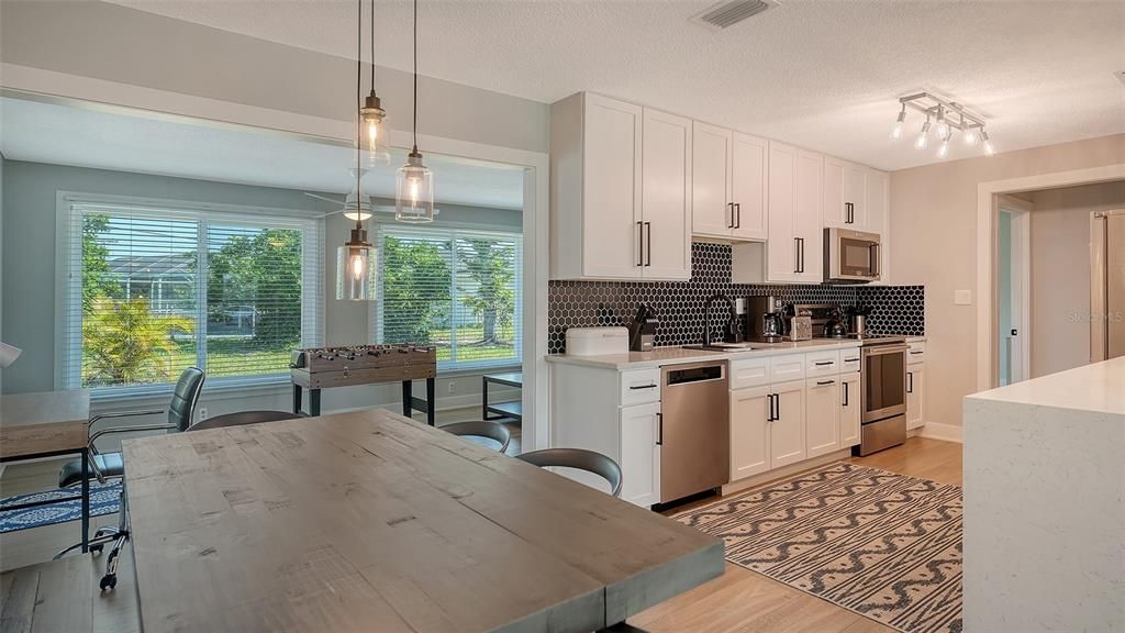 Dining room, Interior, Kitchen, Pendant Lights, Stainless Steel Appliances, Wood Texture Flooring