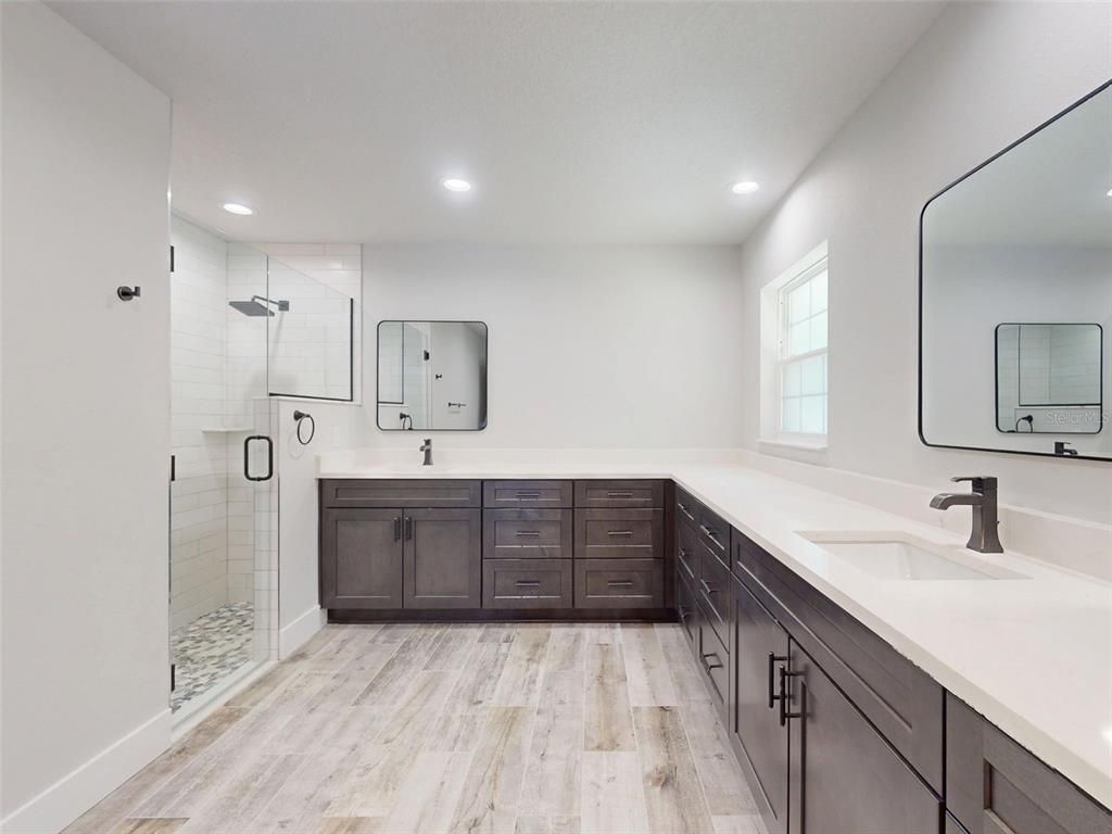 Bathroom, Dual Sink Vanities, Glass Shower, Interior, Recessed Lighting, Wood Texture Flooring