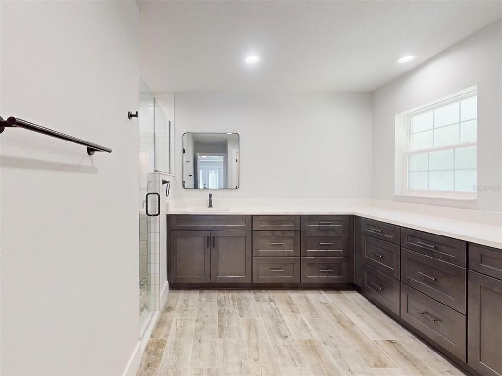 Bathroom, Dual Sink Vanities, Glass Shower, Interior, Recessed Lighting, Wood Texture Flooring